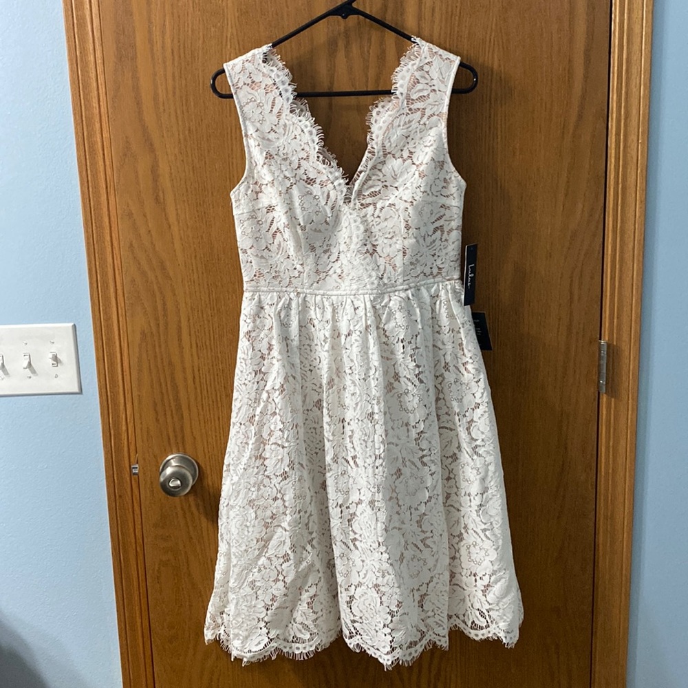 Lulus white lace overlay with sewn in tan color slip and tulle in between